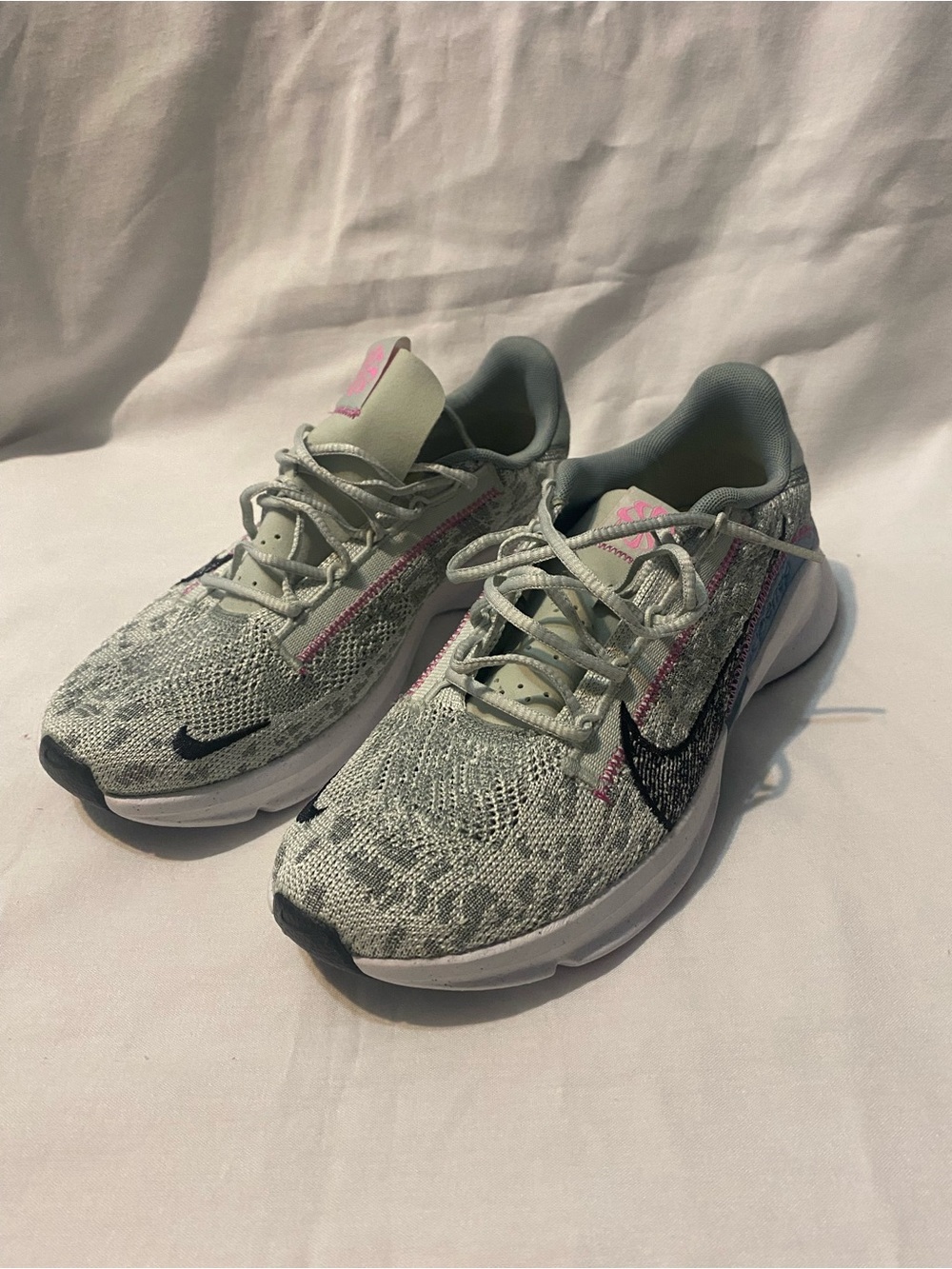 Nike Women's Grey Knit Running Shoes with Pink Accents